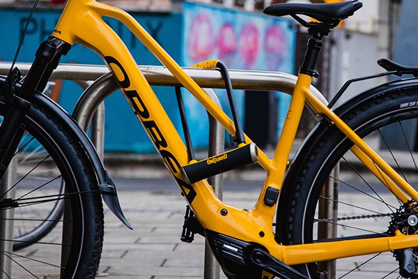 Orbea electric bike locked to a bike stand with an On Guard D-Lock